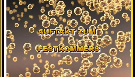 "Auftakt zum Festkommers" als Goldstickerei vor aufsteigenden Champagnerperlen