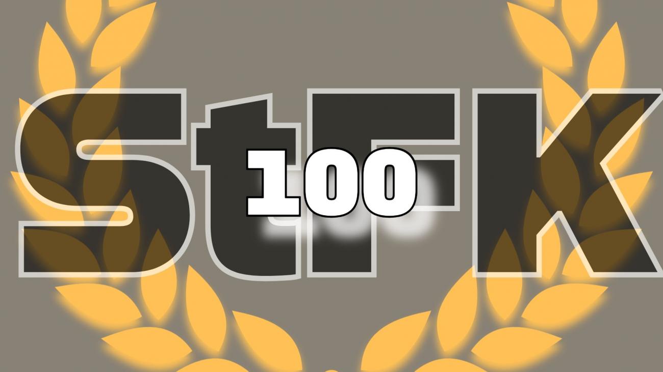 Logo Sitzung StFK 100 Hintergrund grau, darüber Lorbeerkranz gold darüber Kürzel StFK zu oberst und mittig 100 in weiß