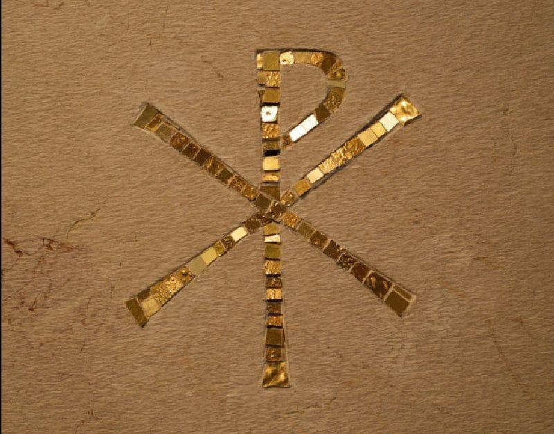 Symbol Religio goldenes "P" und "X" auf dunkelgoldenem Hintergrund